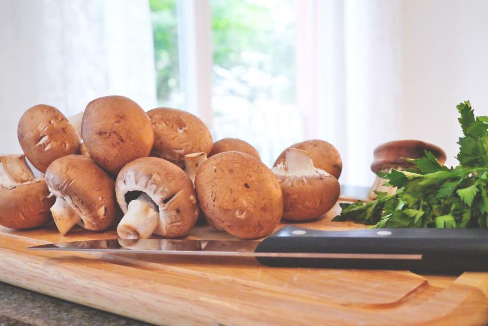 Free Image of Mushrooms on wooden board 