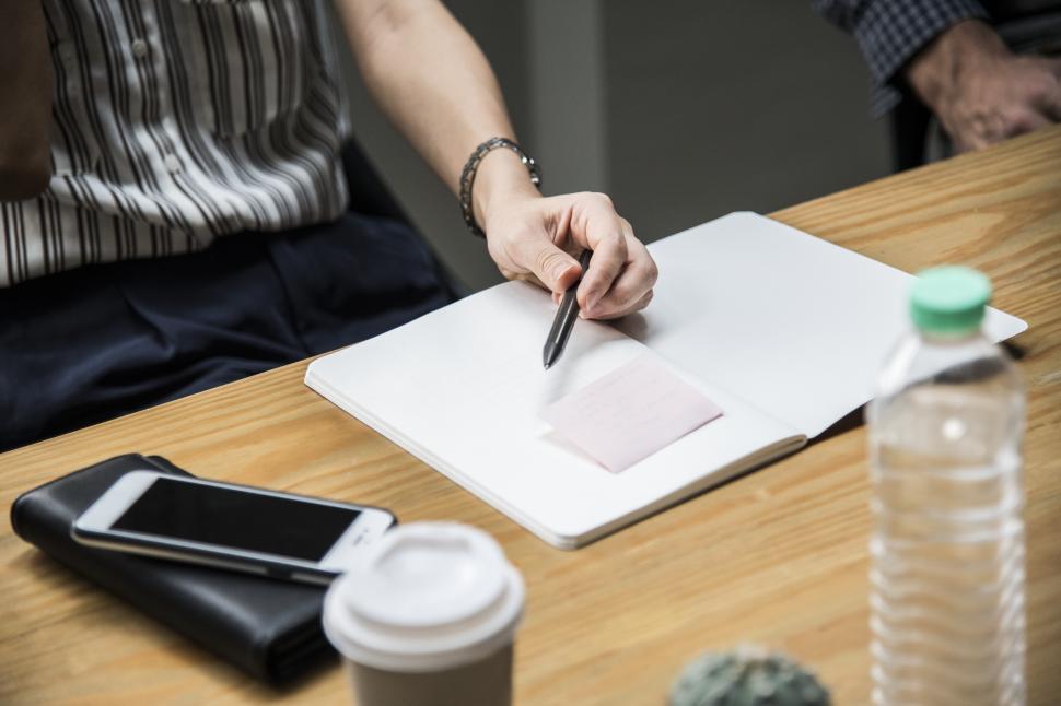 Free Image of Close up of a woman holding a pen 