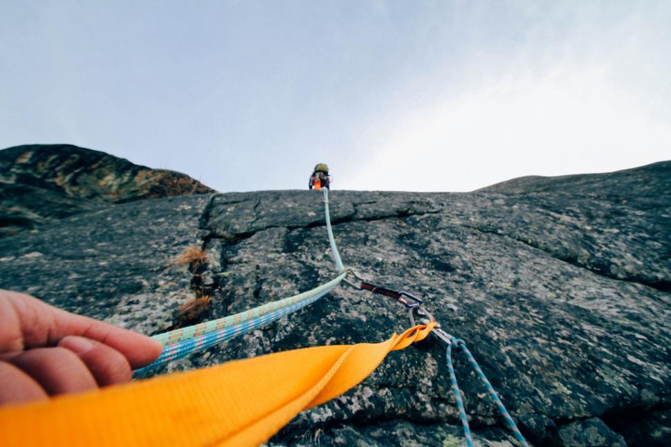 Free Stock Photo of Mountain Climber Holding On A Climbing Rope