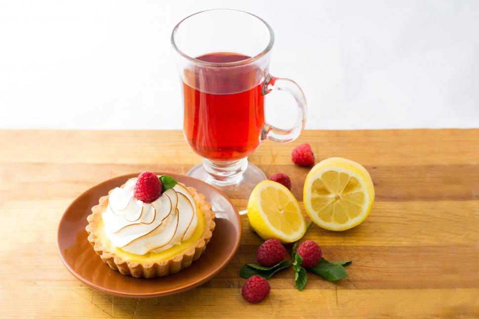 Free Image of Lime Cupcake and Tea with Raspberries  