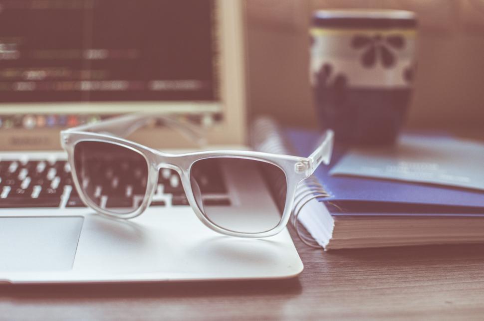 Free Image of Sunglasses on Laptop  