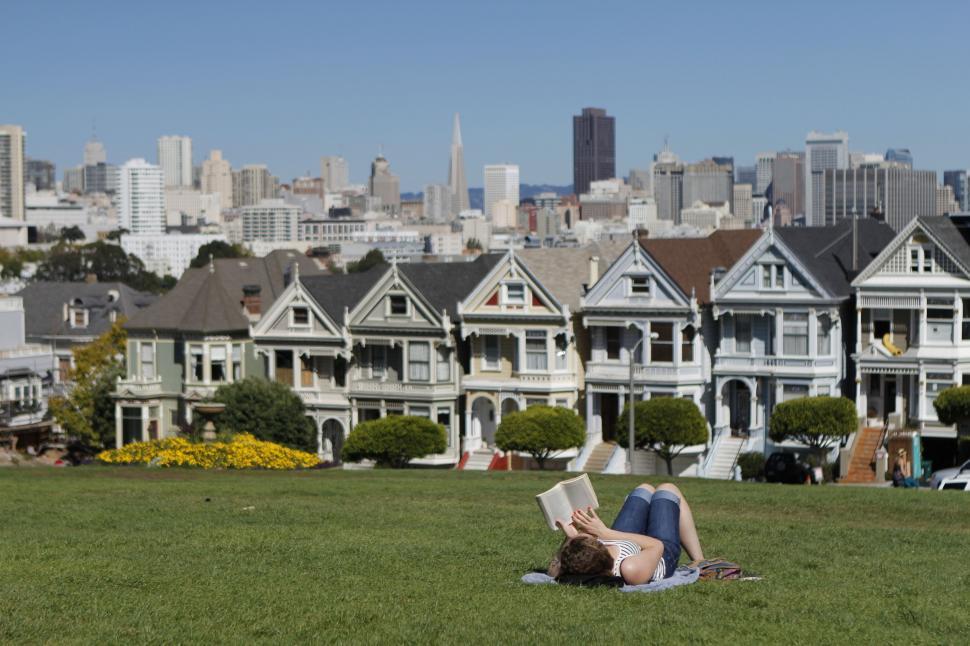 Free Image of Women read book outdoors in the garden park 