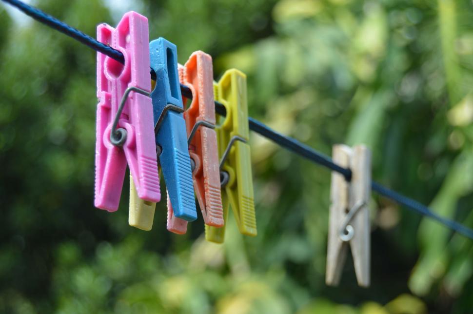 Close Up Of Various Colored Small Clothespins As A Textured