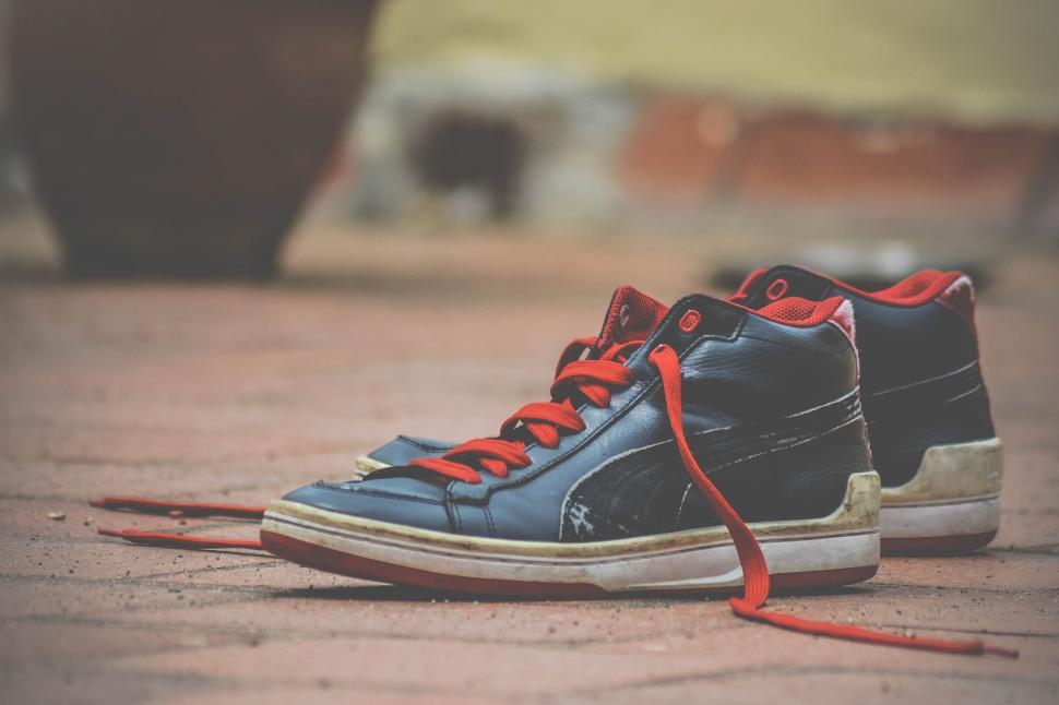 black sneakers with red laces