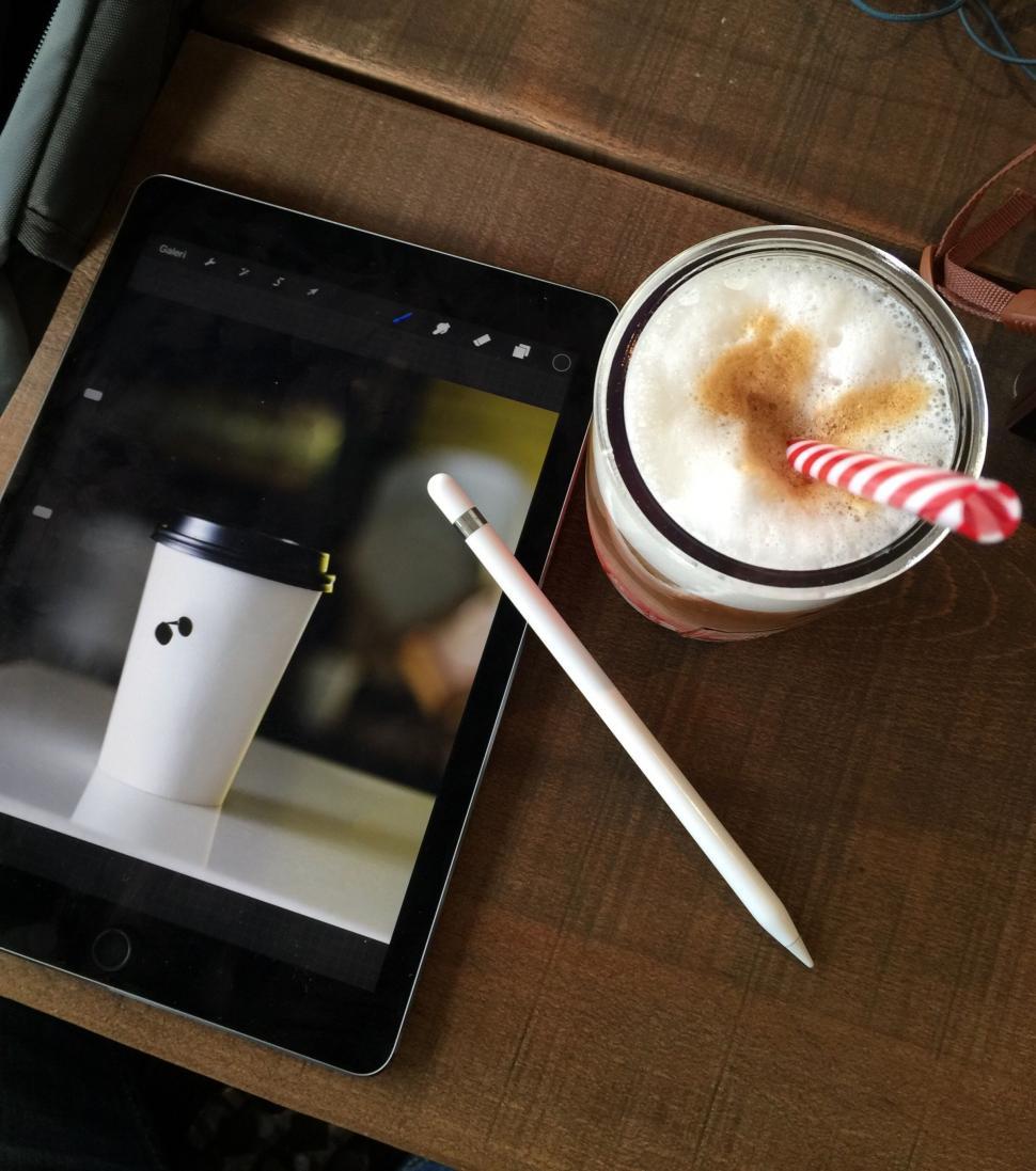 Free Image of Apple Juice and Pencil on wooden table  