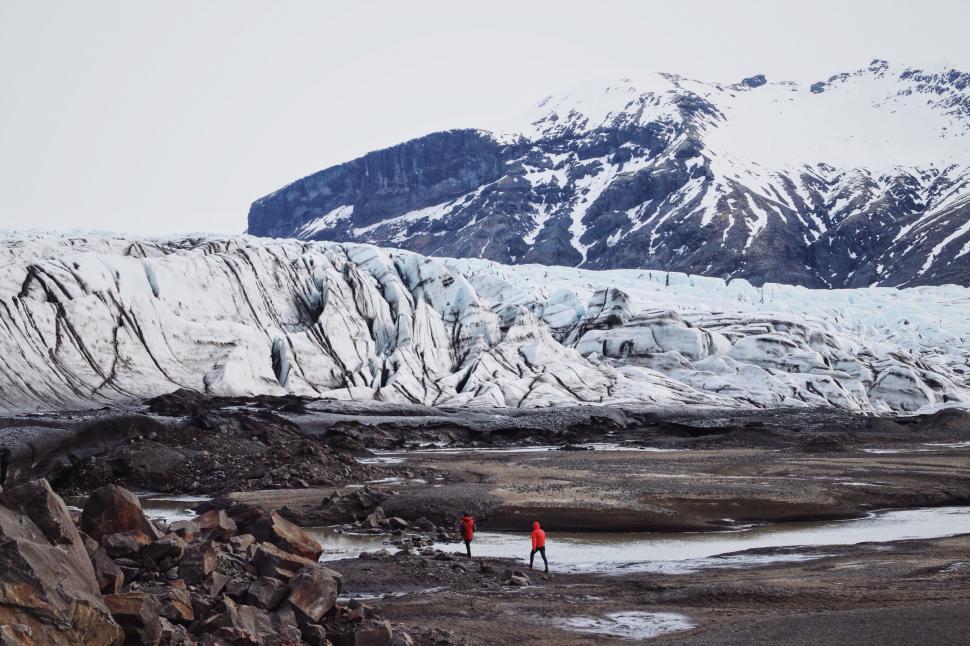 Free Image of Hikers near snow mountains 