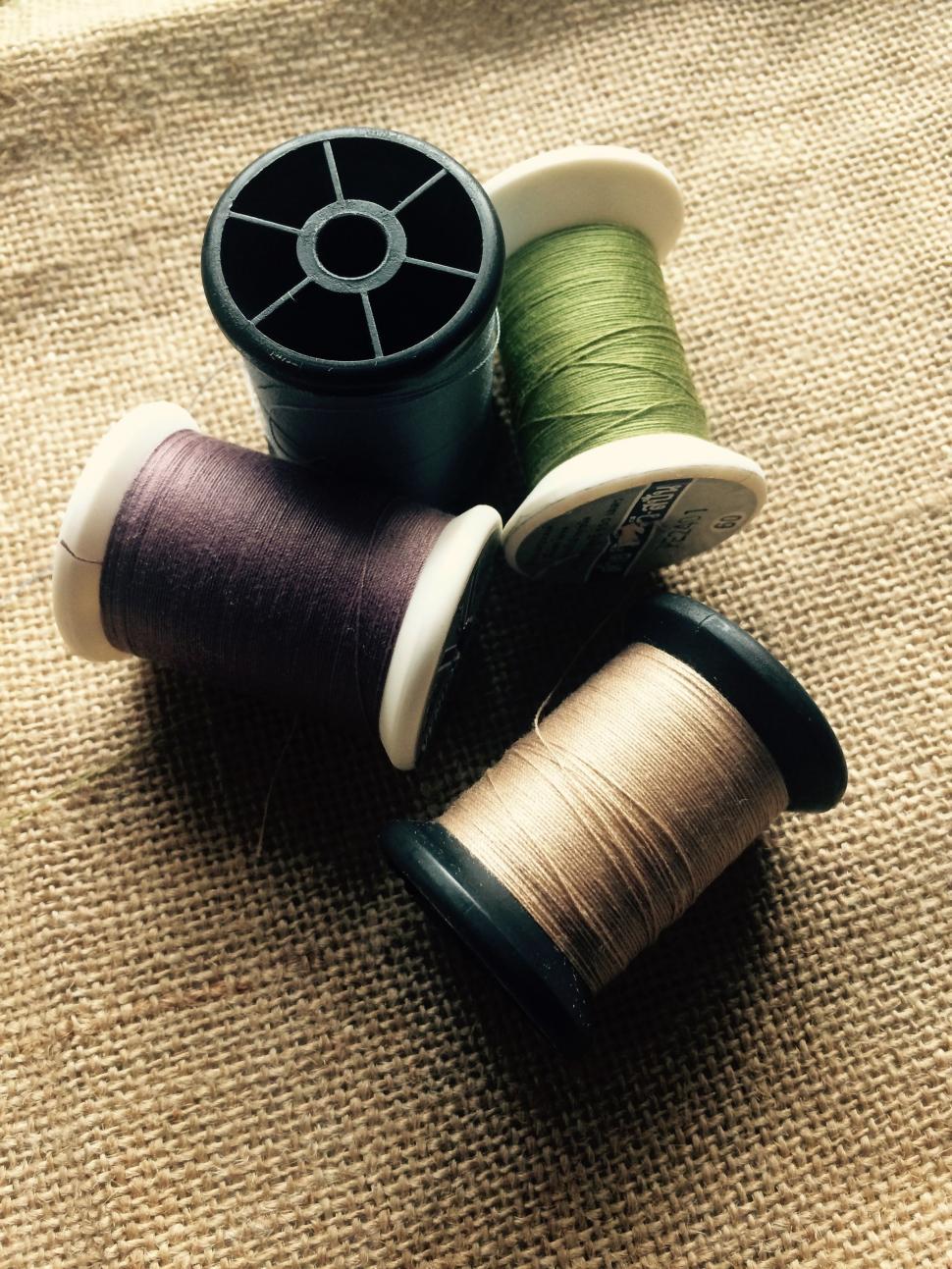 Royalty-Free photo: Brown thread spool in closeup photography