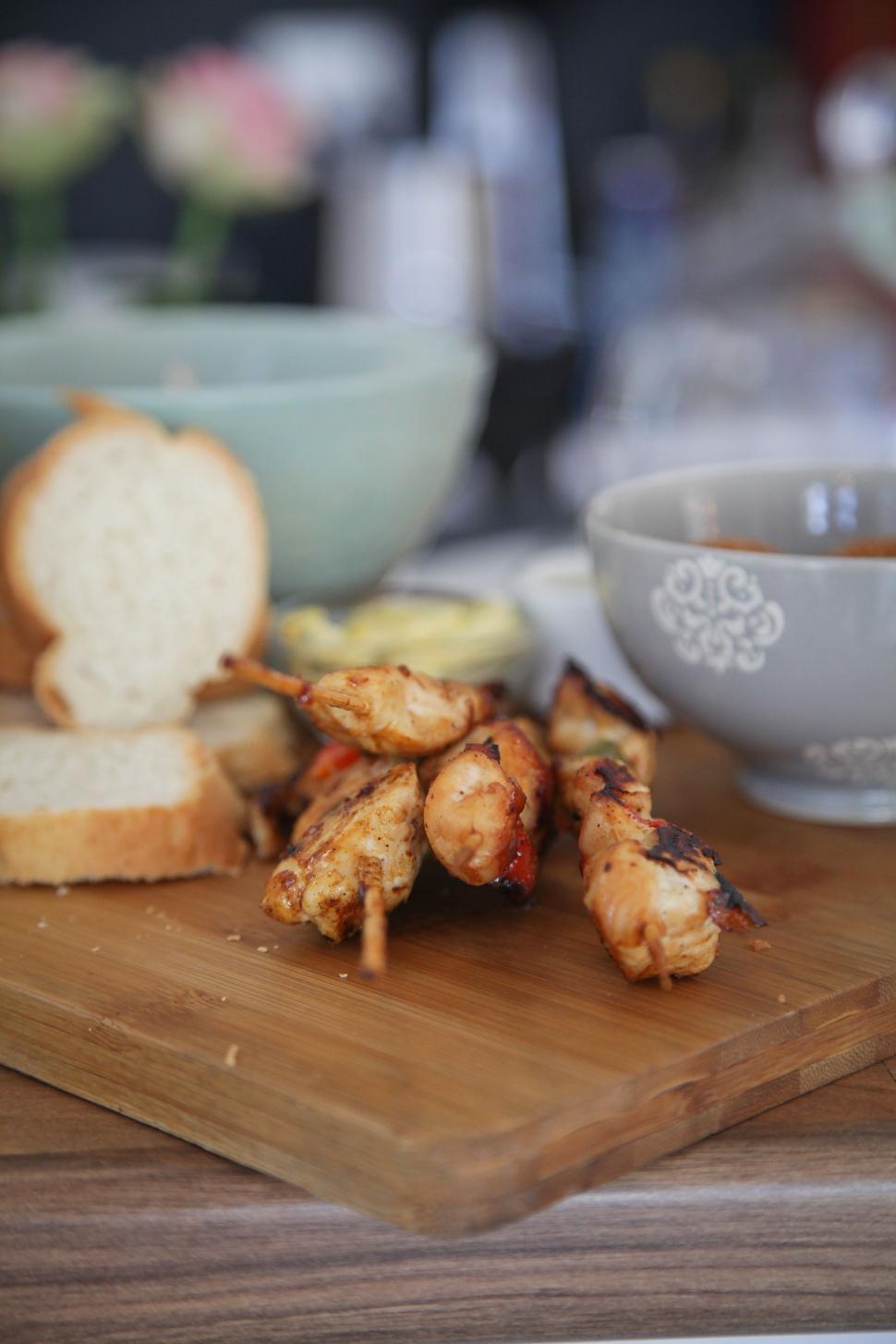 Free Image of Chicken Sticks on chopping board  