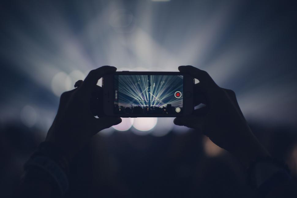 Free Image of Man with smartphone takes mobile photo at Music Concert  