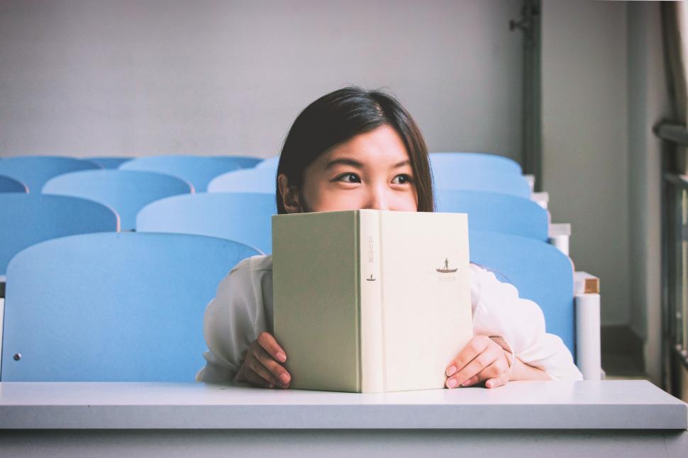 Free Image of Young Woman with book  