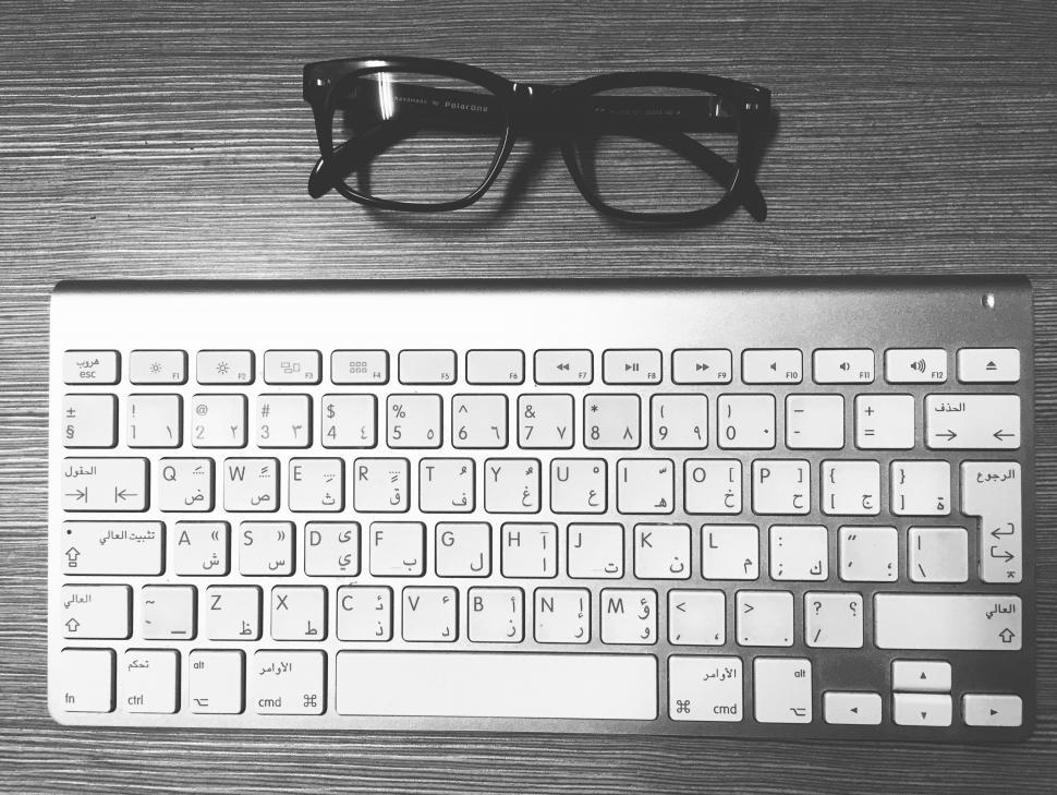 Free Image of Wireless Keyboard and Spectacles  
