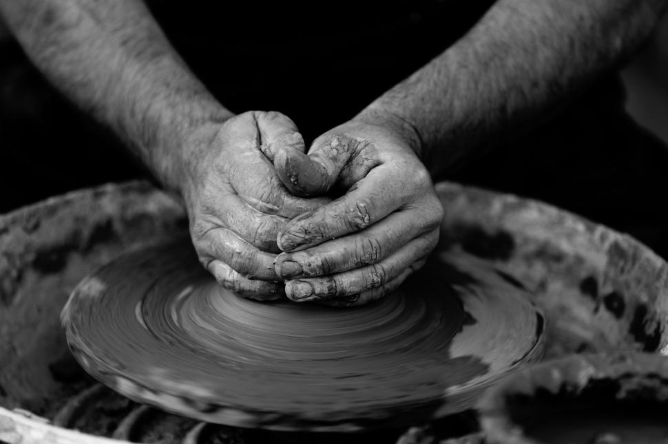 Hands working on pottery wheel. Sculptor, Potter. Human Hands