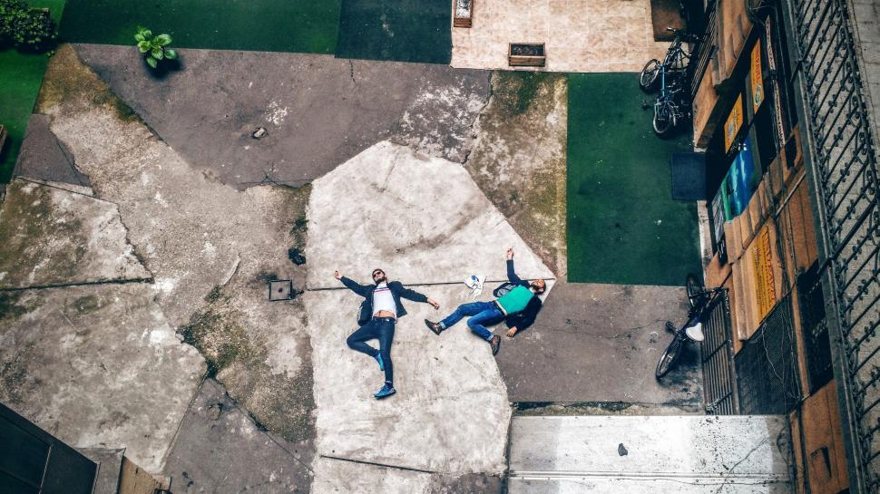 Free Image of Men Sleeping on Terrace  