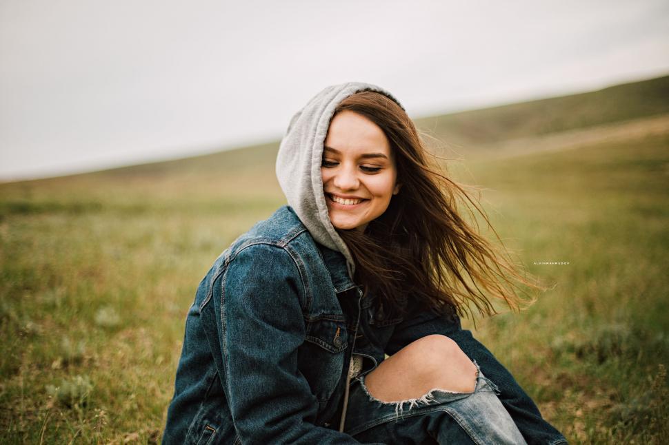 Free Image of Happy Woman Sitting on Grass  