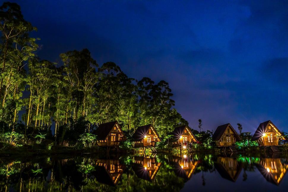 Free Image of Night View of Huts near lake  