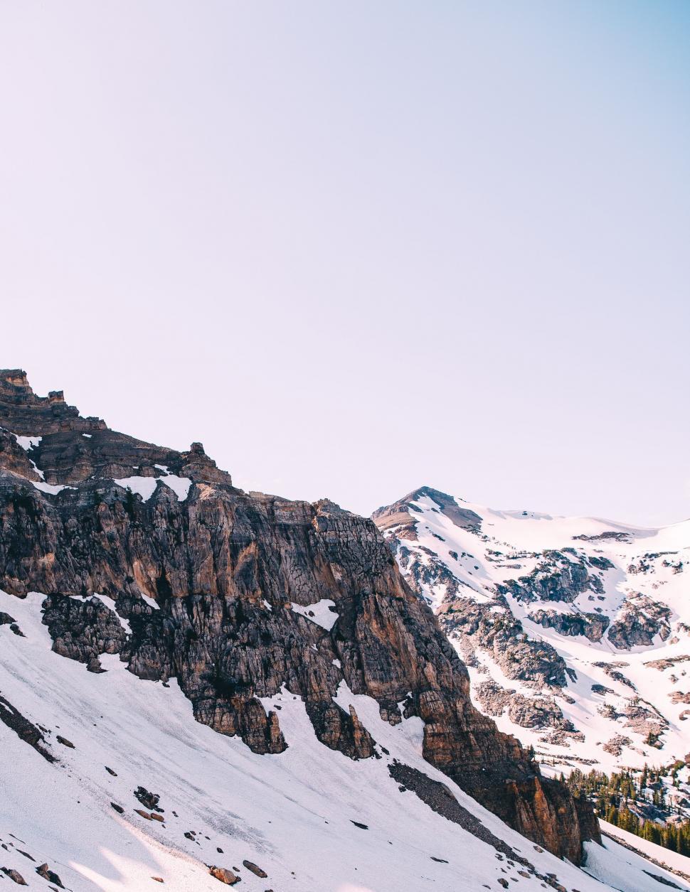 Free Image of Rock Mountains in Snow during daytime  