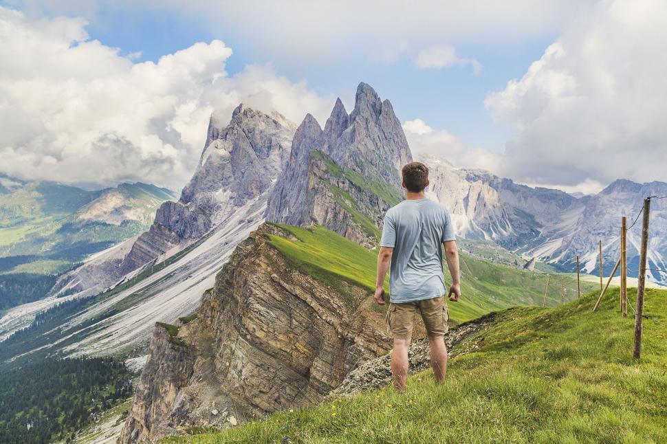 Free Image of Man on mountain cliff  