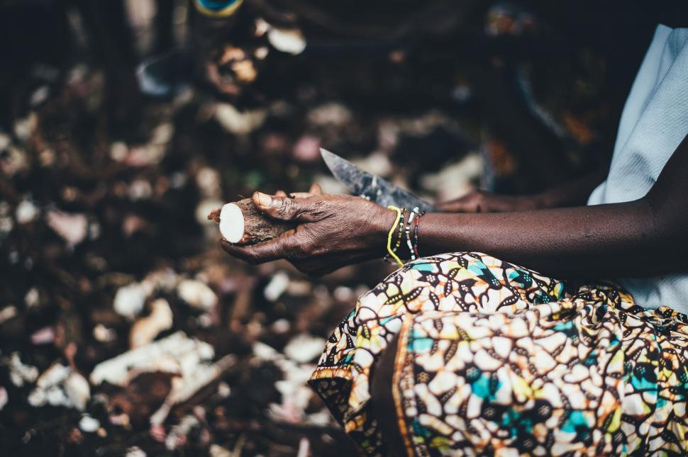 Free Image of Old Woman with Sweet Potato  