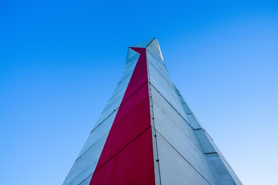 Free Image of Red and White Building from below 