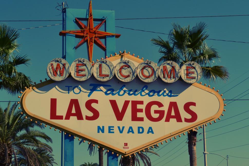 An Empty Street With A Las Vegas Sign Near Palm Trees At Dusk Background, Las  Vegas Sign Picture Background Image And Wallpaper for Free Download