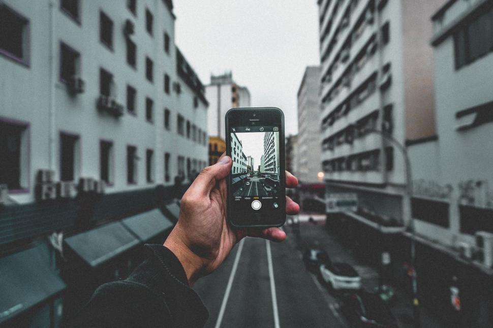 Free Image of Taking picture of road with phone 