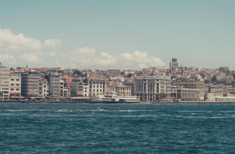 Free Image of Blue Sea and Ship With Houses  