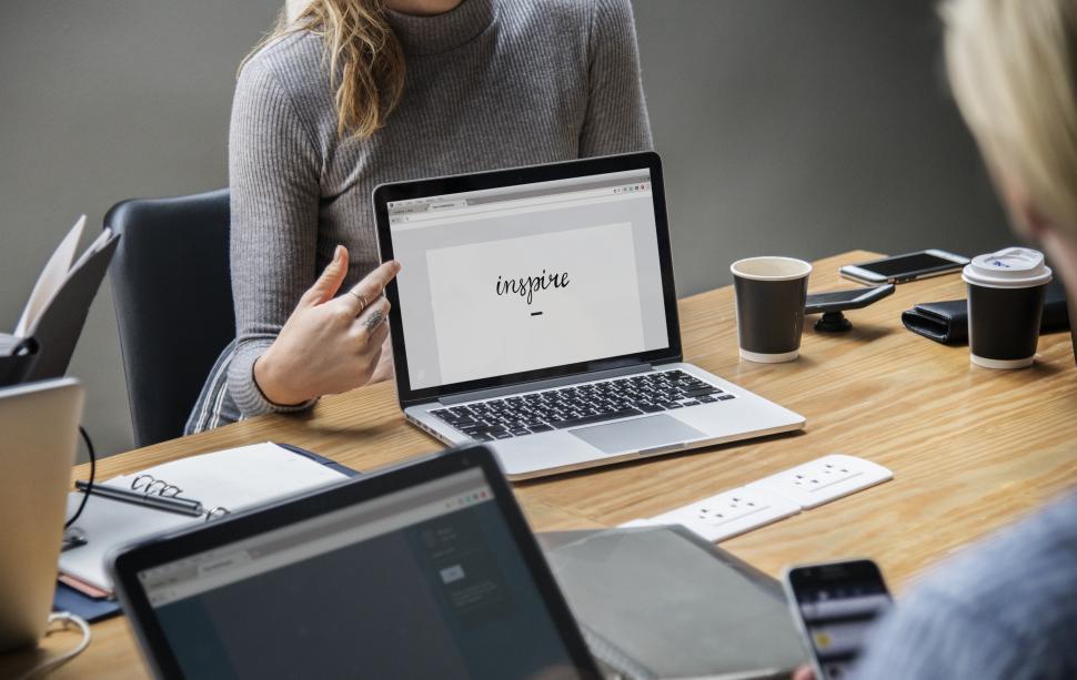 Free Image of Anonymous woman pointing at a laptop 