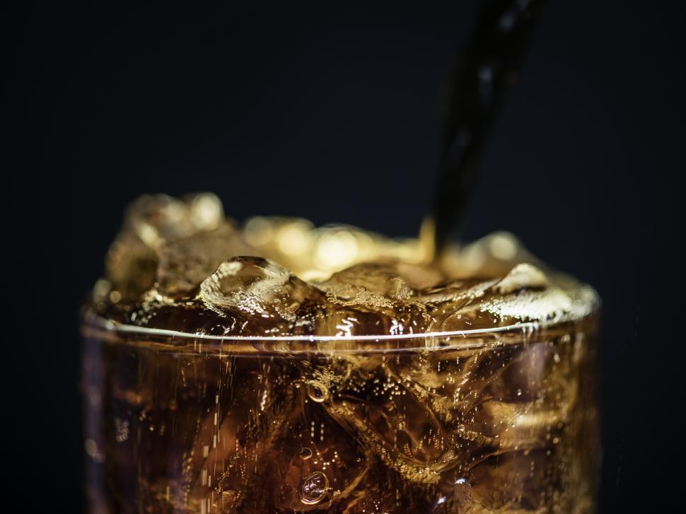 Cold Fizzy Cola Soda With Ice In Glass Cup Stock Photo - Download