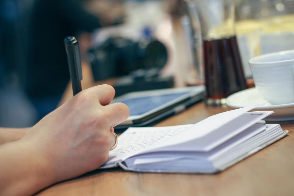 Free Image of Writing on Notebook  