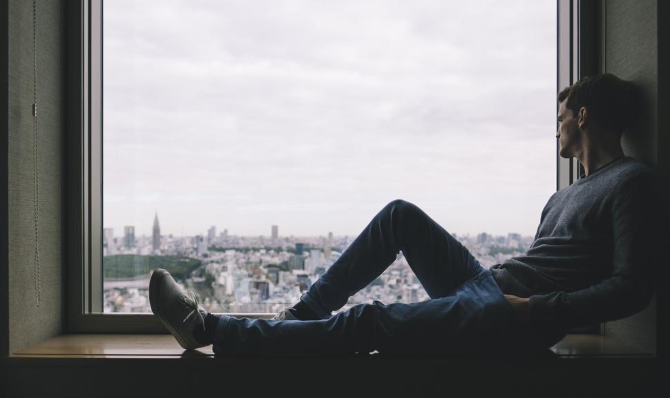 Free Stock Photo of Alone Man Sitting at Window