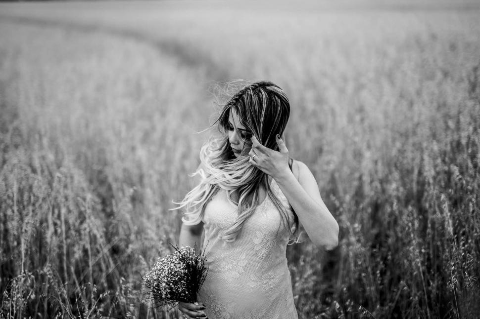 Free Image of Young Woman with long hair in wheat field - B&W 