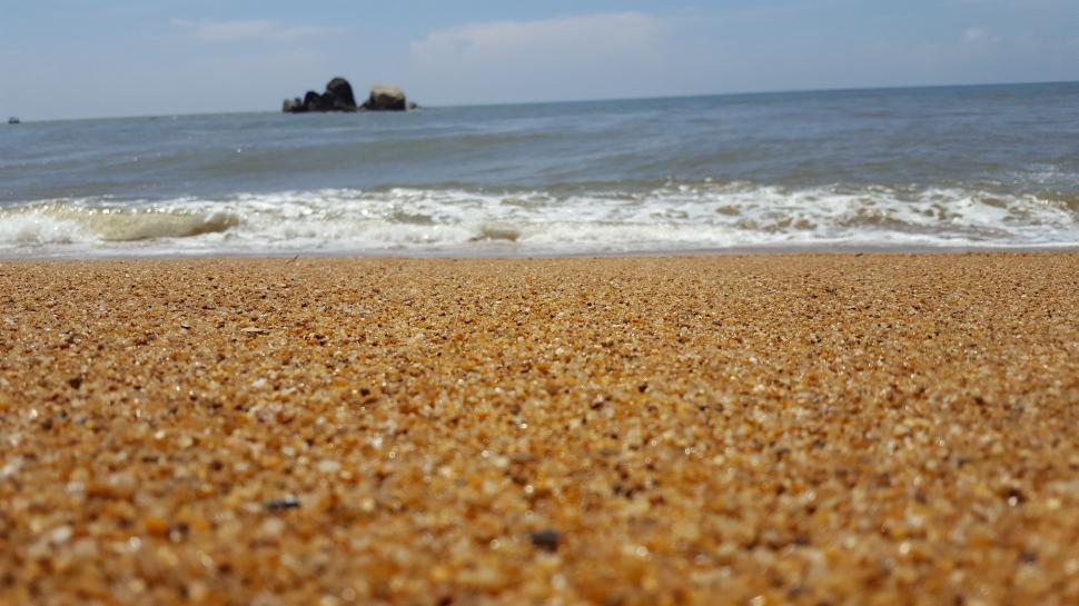 Free Image of Beach Sand and ocean  
