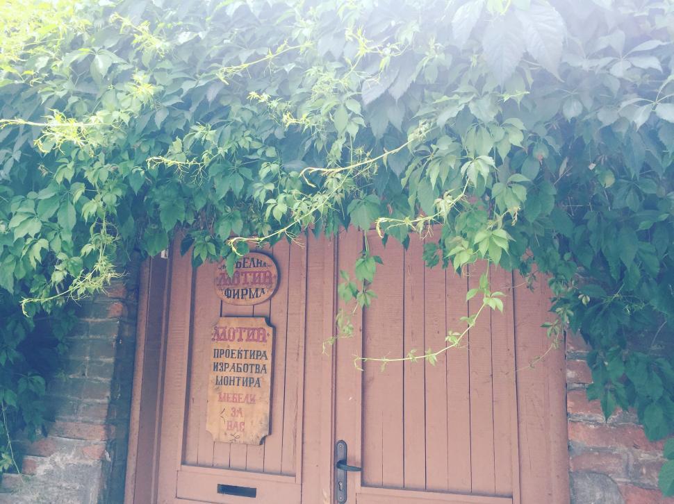 Free Image of Wooden House Door with Red Brick Wall 