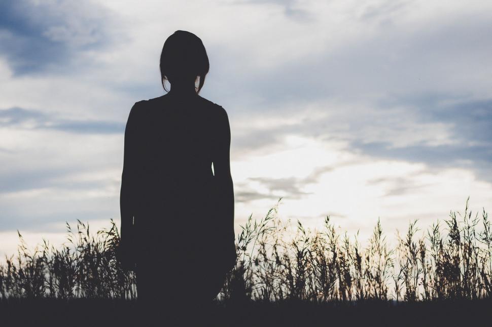 Free Stock Photo of Rear dark view of woman with white sky