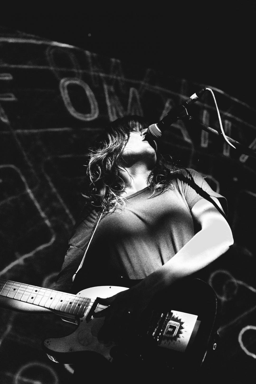 Free Image of Courtney Melba Barnett Singing on Stage  