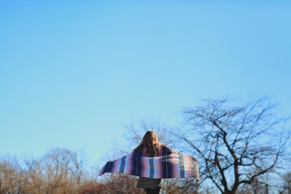 Free Image of Back view of woman with blanket 