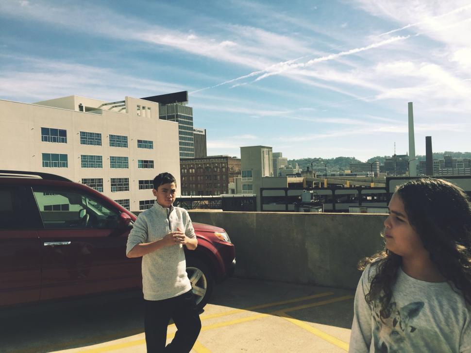 Free Image of Siblings at parking lot  
