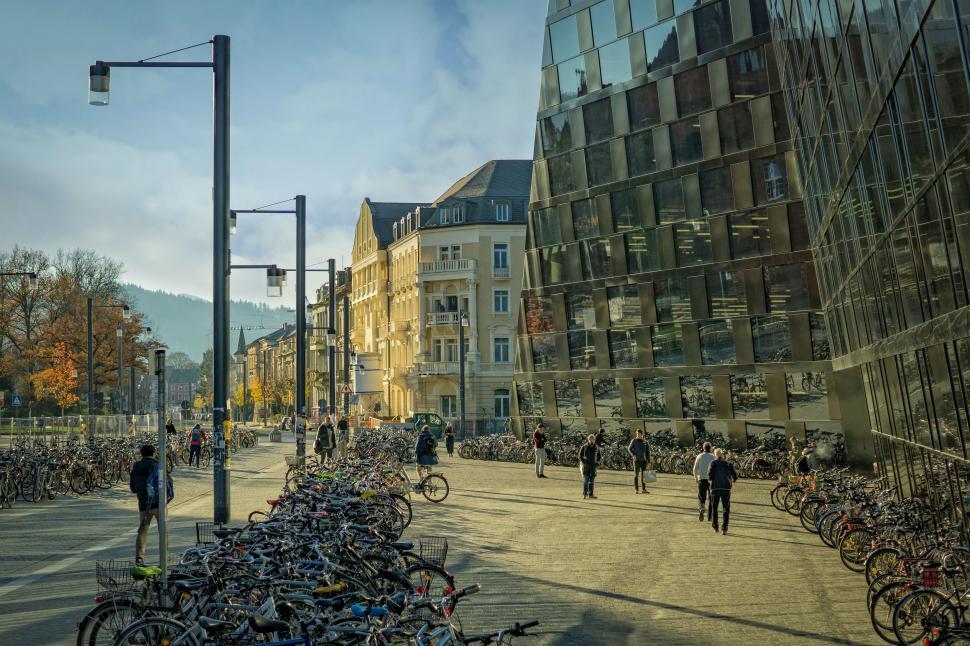 Free Image of People Walking Outside a Glass Building 