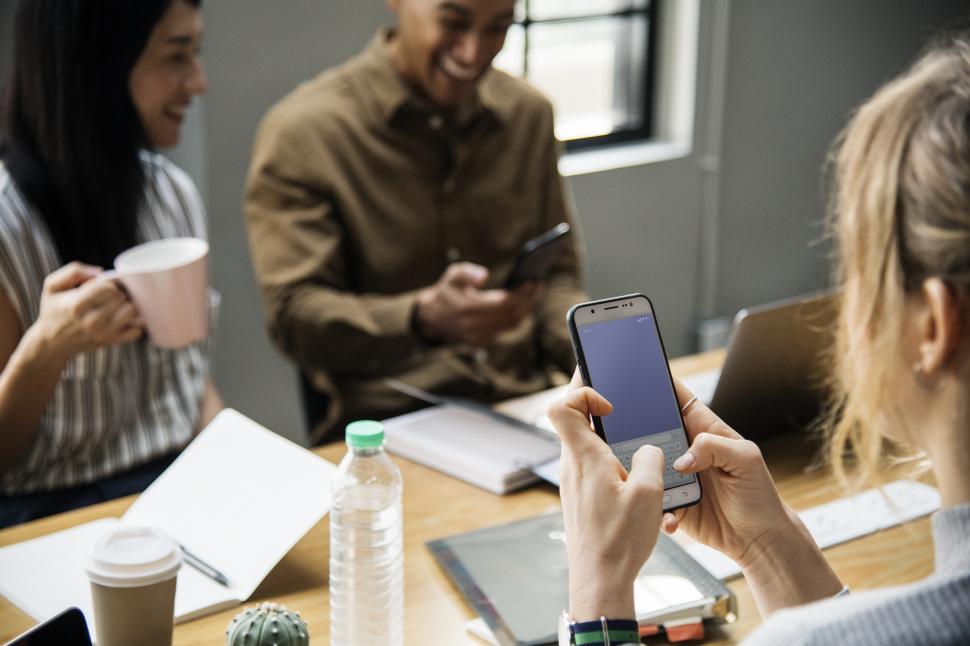 Free Image of Colleagues in the office around a table 