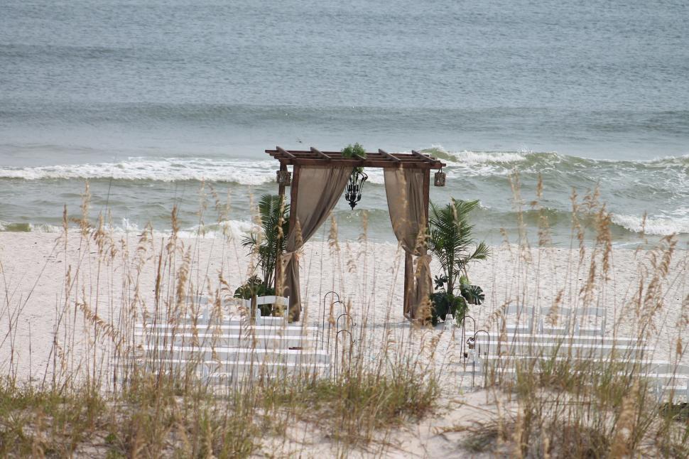 Free Image of Wedding Gate on the beach with ocean in the background  