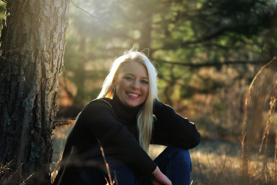 Free Image of Smiling Blonde Woman in the forest  