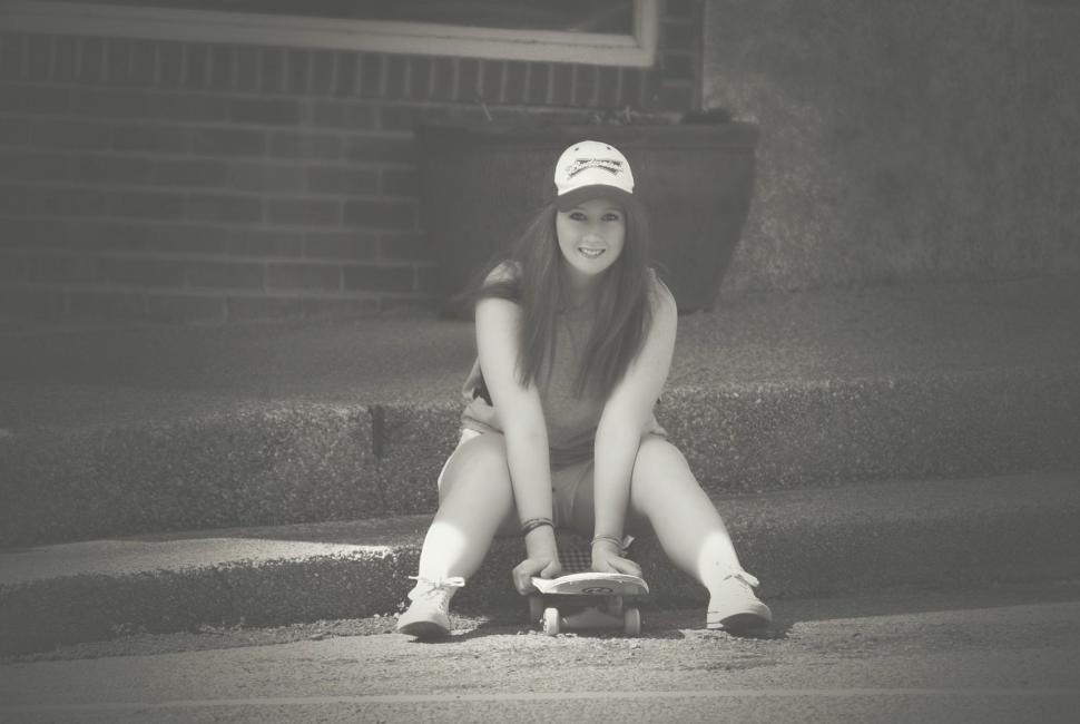 Free Image of Woman with Skateboard - Looking at camera  