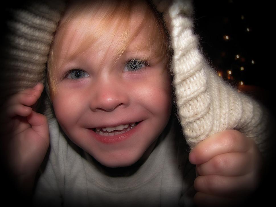 Free Image of Little Boy Playing Hide And Seek  