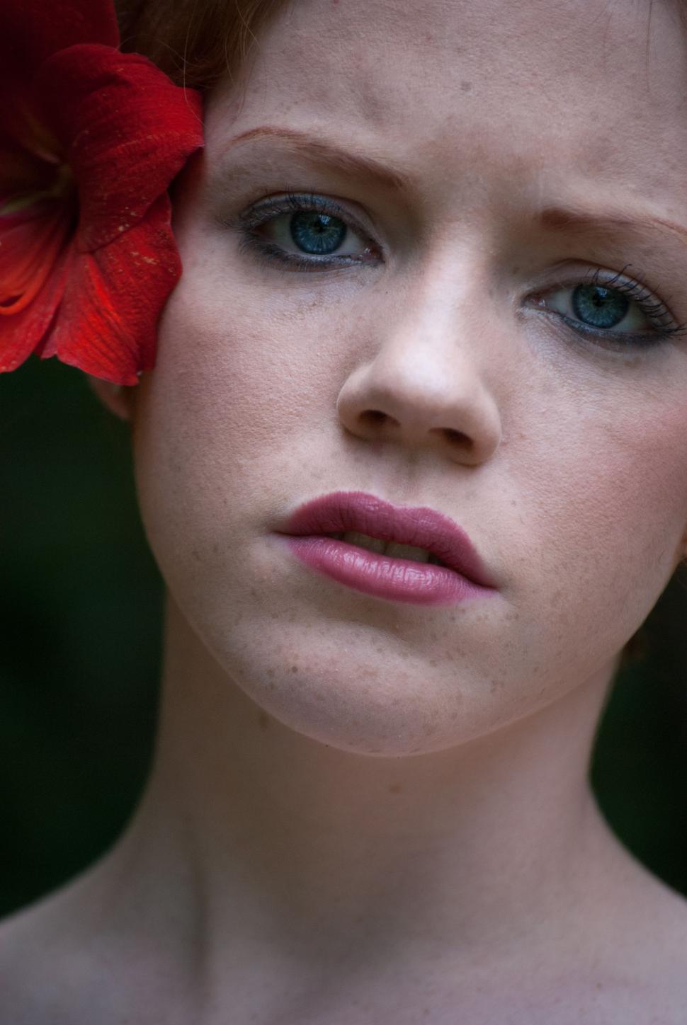 Free Image of Woman Face With Red Flower 