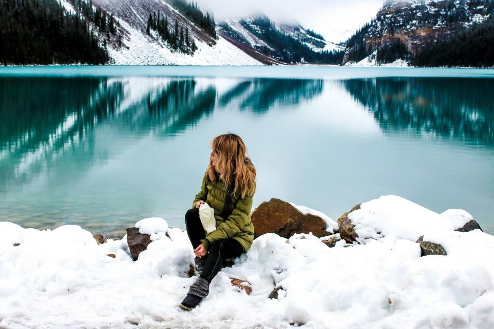 Free Image of Woman and Lake Louise With Snow Mountains - Banff National Park 