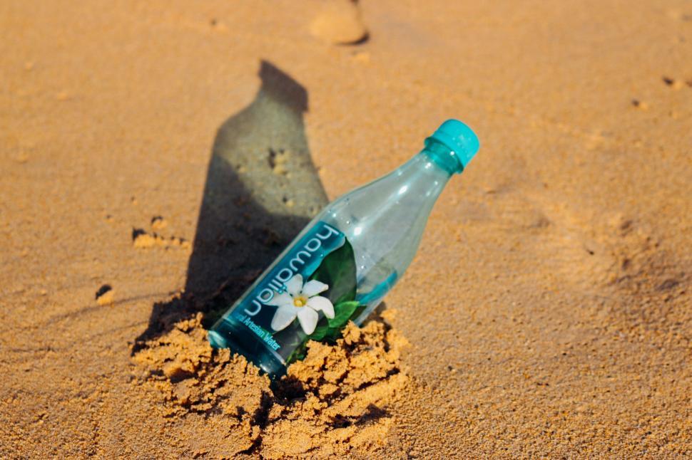 Reusable water bottle on the beach Stock Photo by ©nito103 279147558