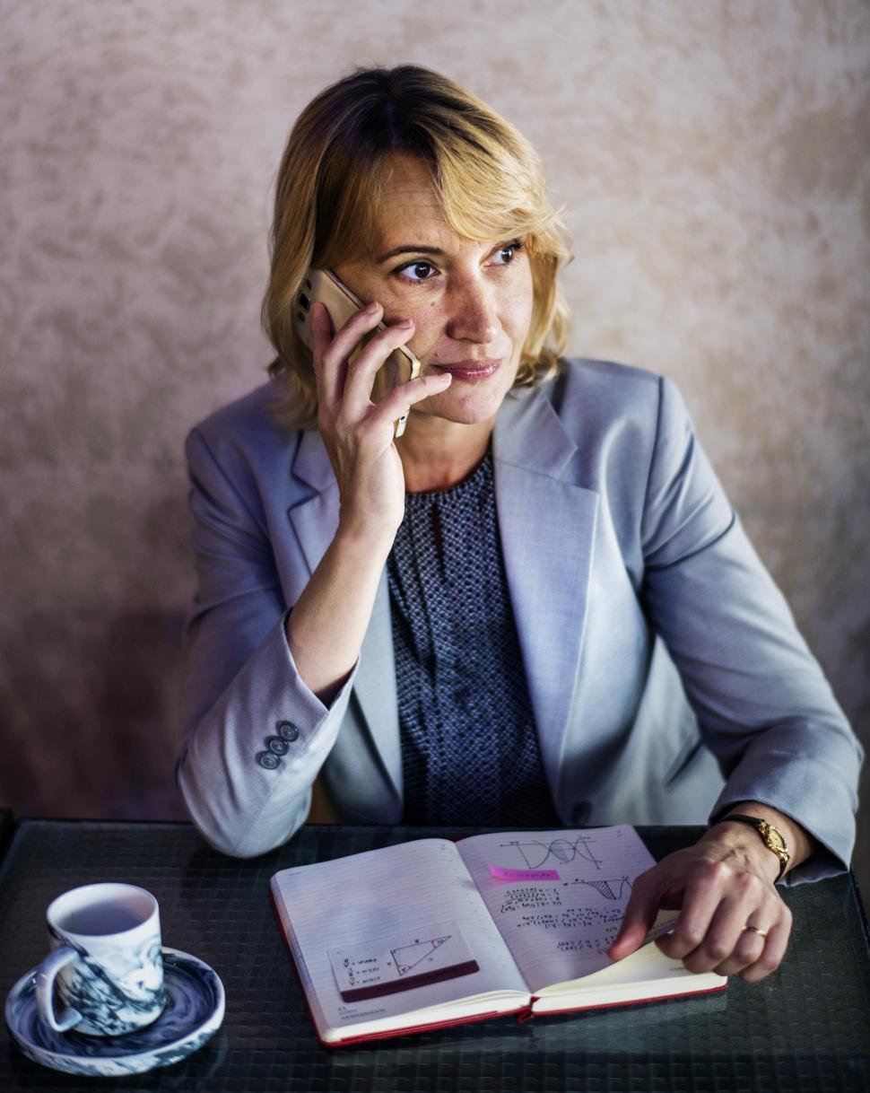 Free Image of A Caucasian woman taking call on her mobile phone 