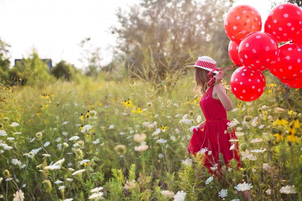 Free Stock Photo of Red Dress Woman in Meadow With Flowers