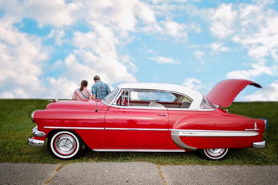 Free Image of Vintage Car and People With Green Grass 
