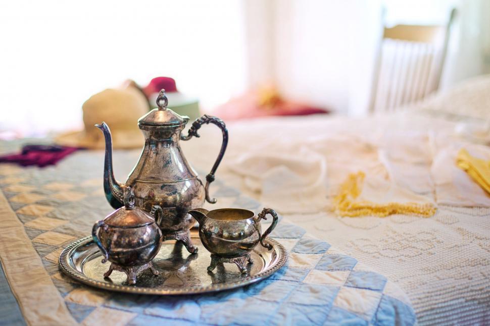 Luxury silver vintage tea kettle isolated on white Stock Photo by